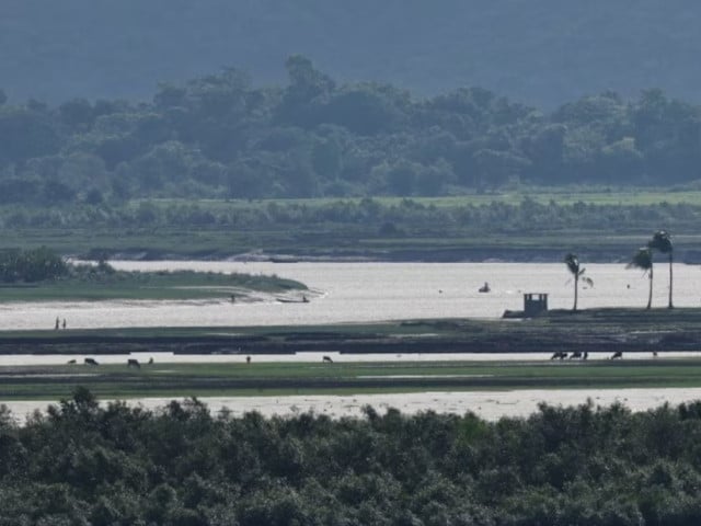 people of maungdaw township of myanmar are seen from the teknaf area of bangladesh at the myanmar bangladesh border during the ongoing conflict in the rakhine state of myanmar in cox s bazar bangladesh june 27 2024 photo reuters